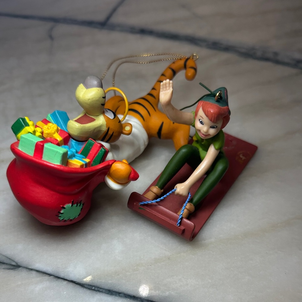 Disney Peter Pan and Tigger angel holding a bag of gifts, Christmas ornaments